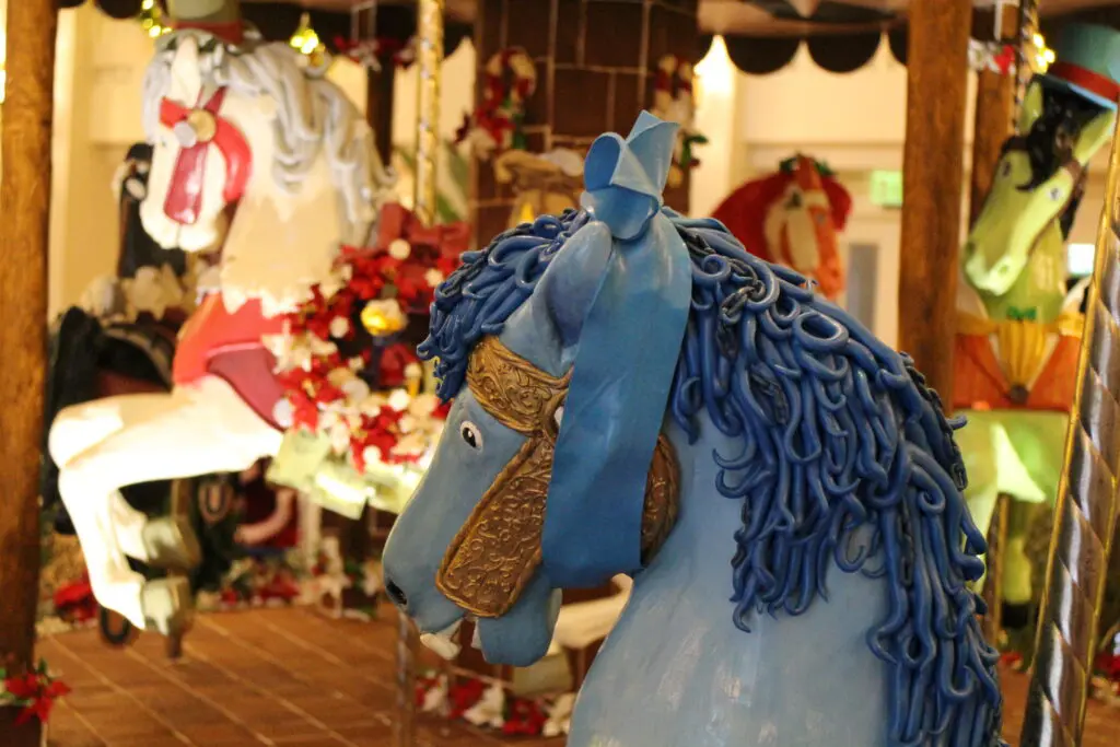 A blue carousel horse made of edible ingredients.