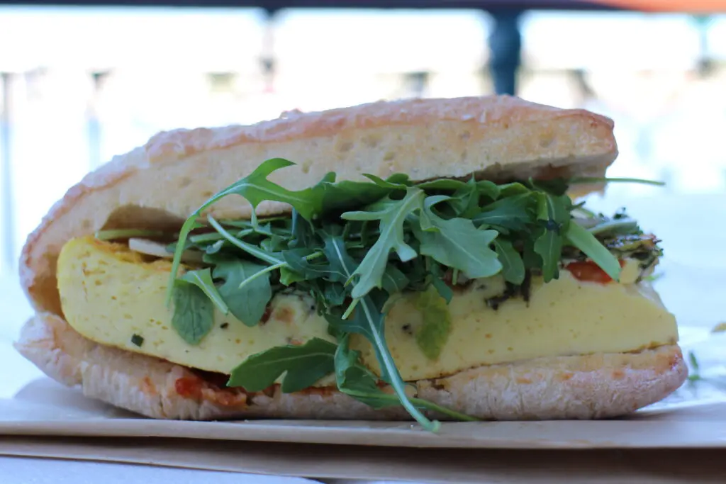 BoardWalk Deli breakfast sandwich with egg and arugula.