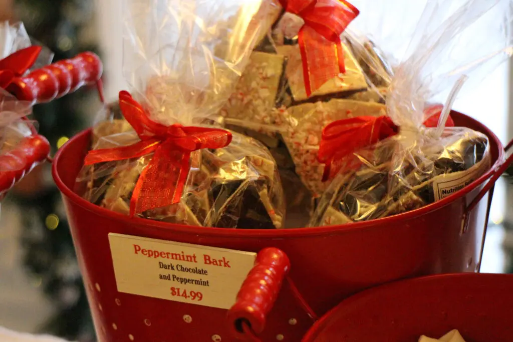 Disney World peppermint bark packaged with a red bow.