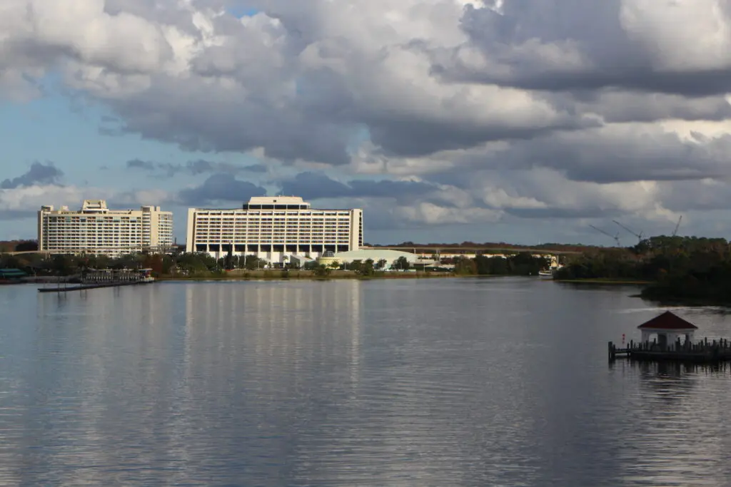 The Contemporary and Bay Lake Tower buildings reflecting off of a lake at Disney World.