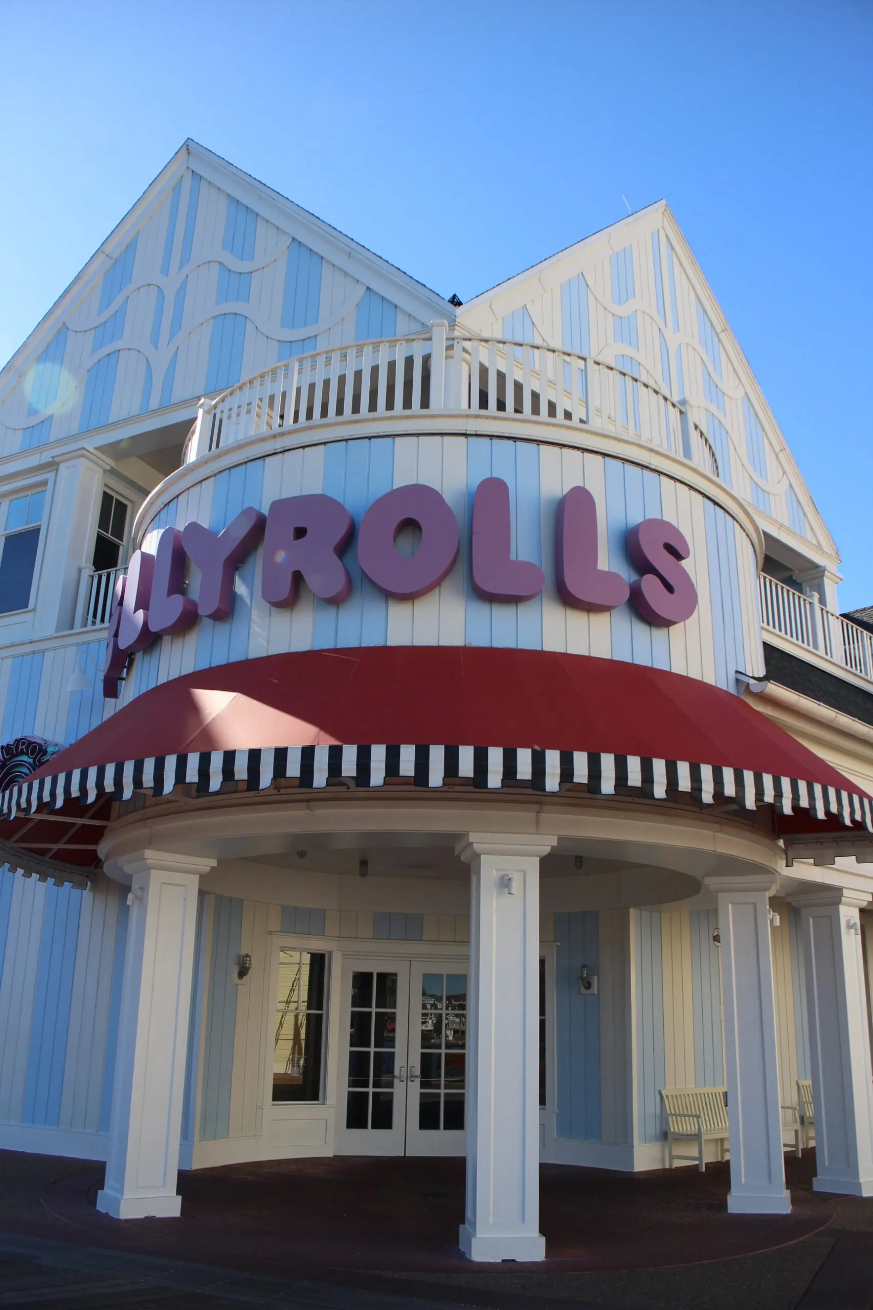 Jellyrolls red letters on a blue and white striped building.