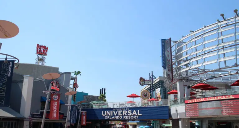 A blue sign reads Welcome to Universal surrounded by many restaurant signs.