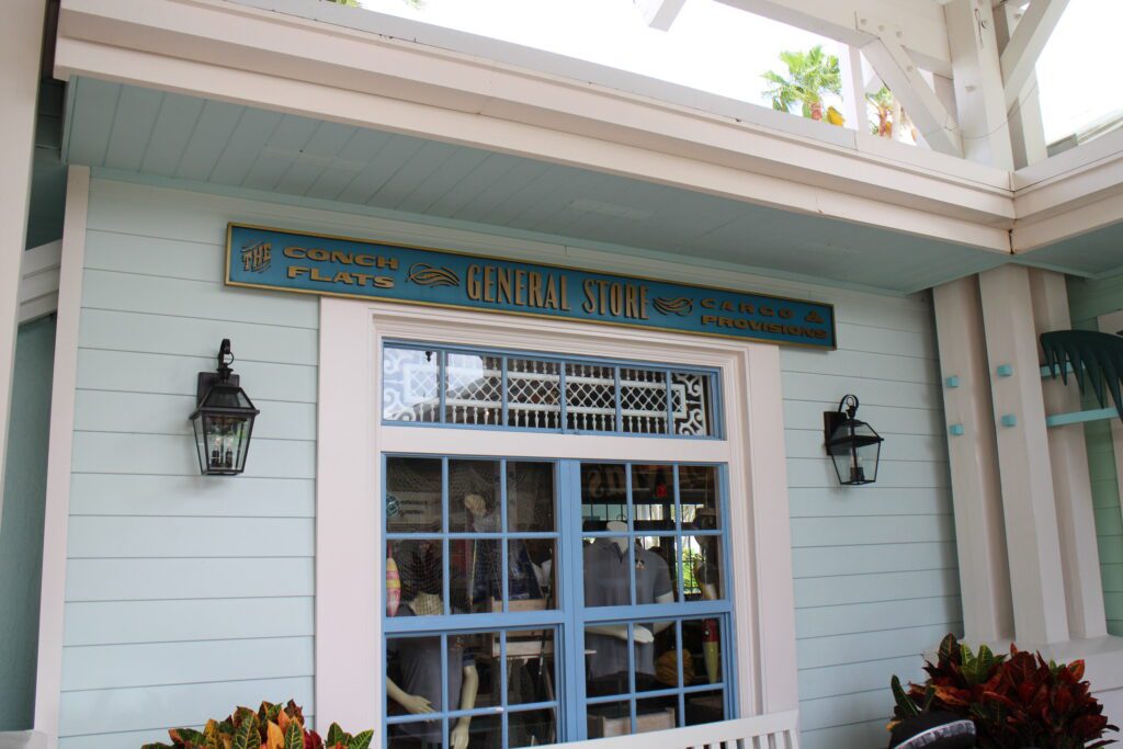 Conch Flats General Store building in a pastel blue with signage over the window.