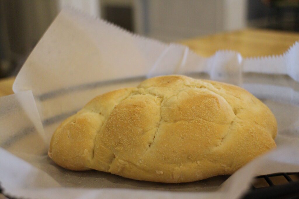 Olivia's Cafe pineapple coconut bread loaf in a basket.