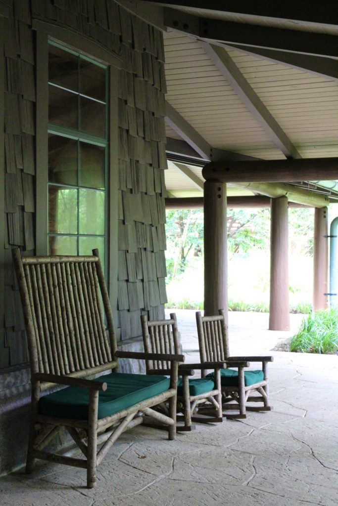 Wooded chairs in front of the shingled Boulder Ridge Villas building.