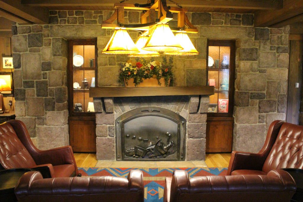 Boulder Ridge Villas lobby fireplace with a train design.