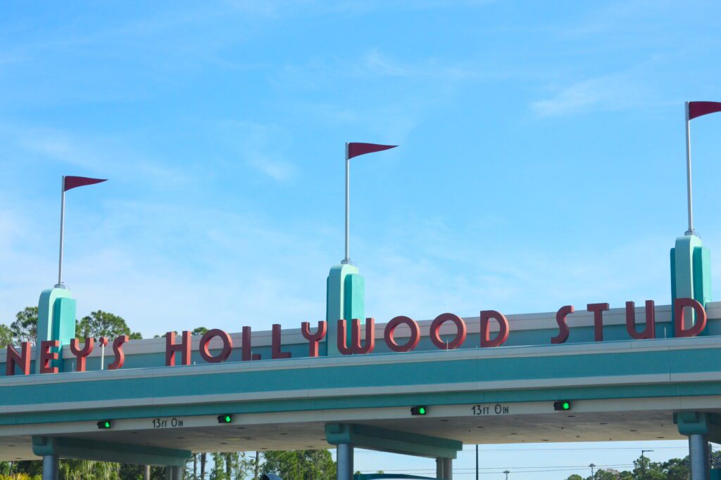 The Disney's Hollywood Studios entrance sign in teal with red letters.