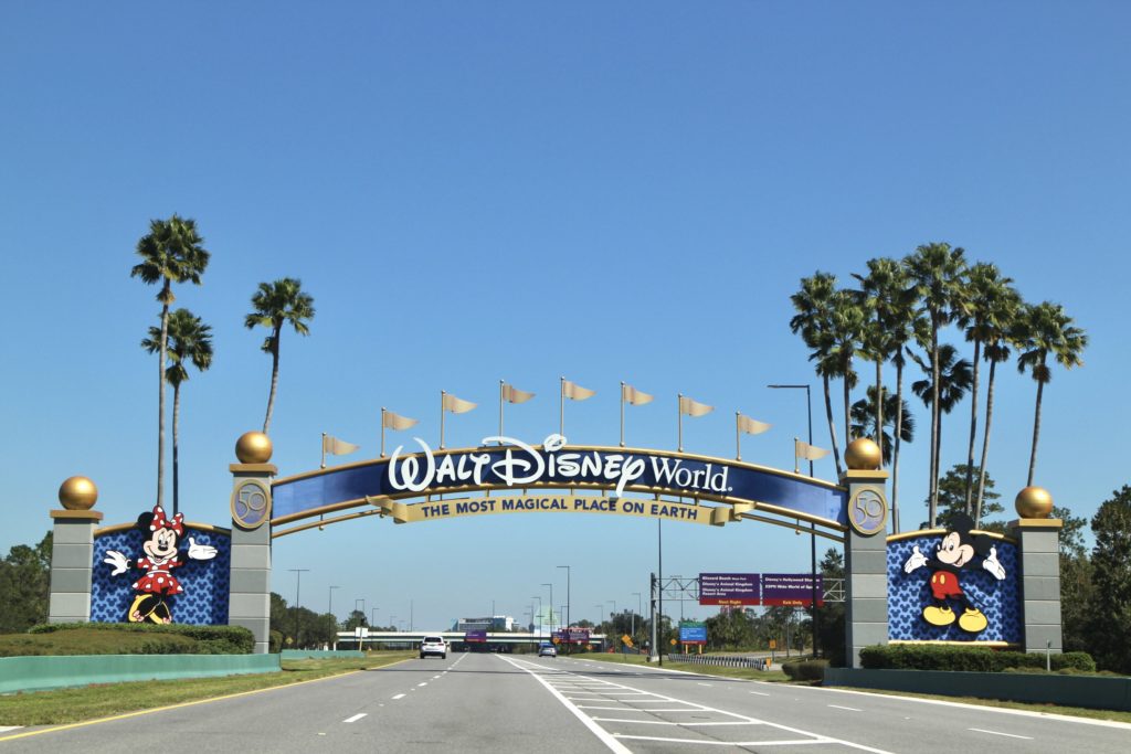 Disney World entrance gate with Mickey and Minnie on each side.