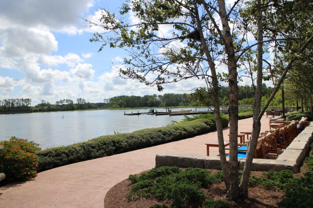 An outdoor seating area on a lake at Disney's Wilderness Lodge.