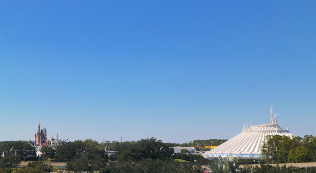 Castle and Space Mountain skyline in front of a blue sky