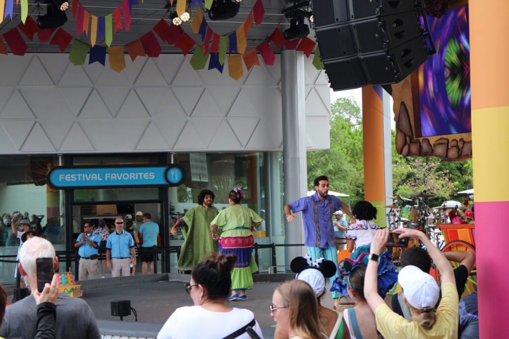 Celebracion Encanto show at Epcot with Mirabel and Bruno.