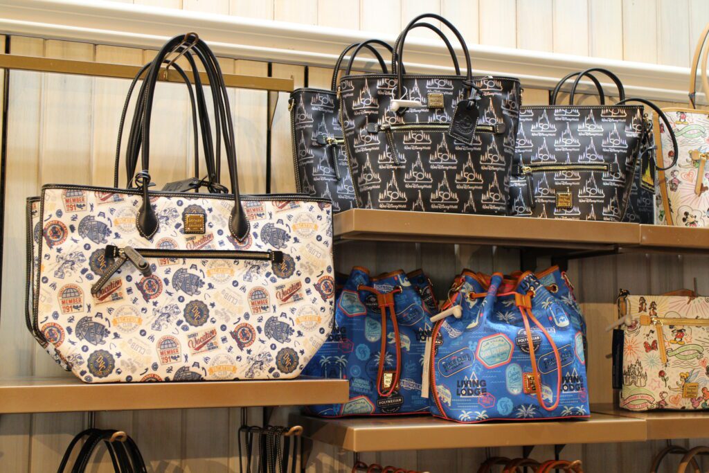 Disney Vacation Club Dooney and Bourke bags on display.