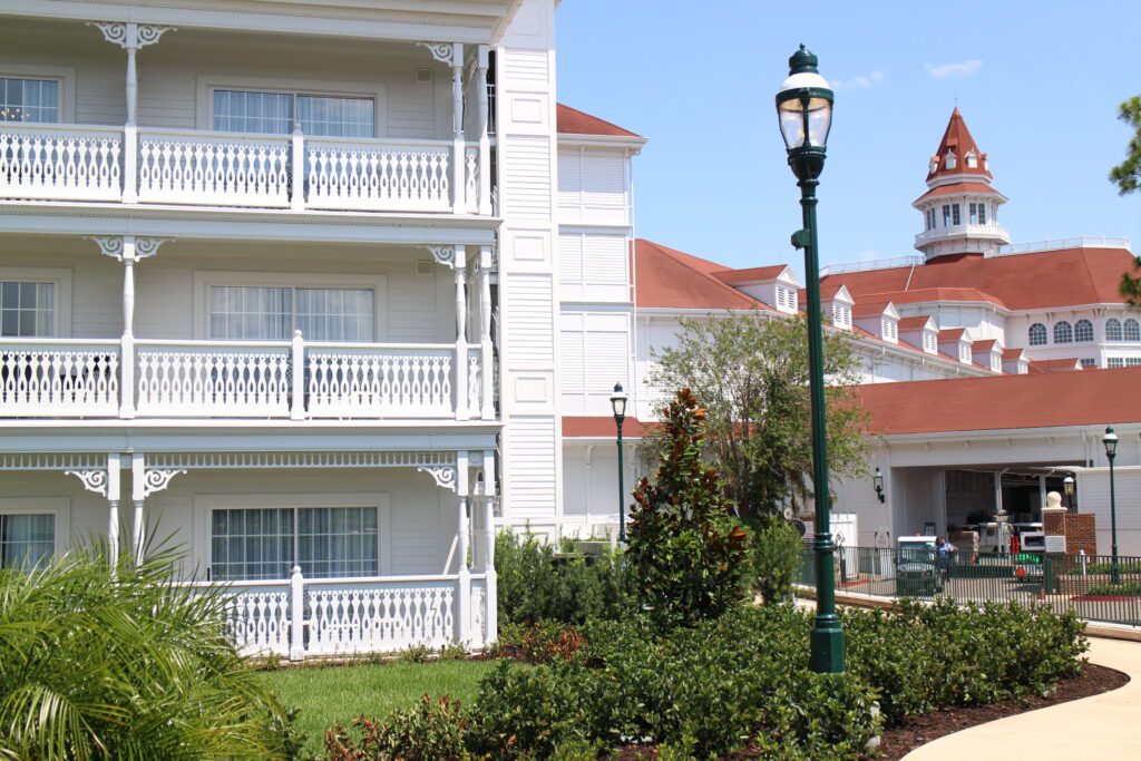 A Grand Floridian white resort building with red roofs.
