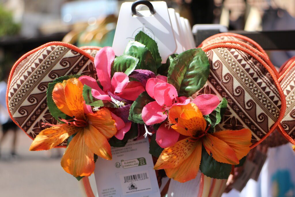 Moana ears at Disney World featuring a wave print and fake flowers over the crown.