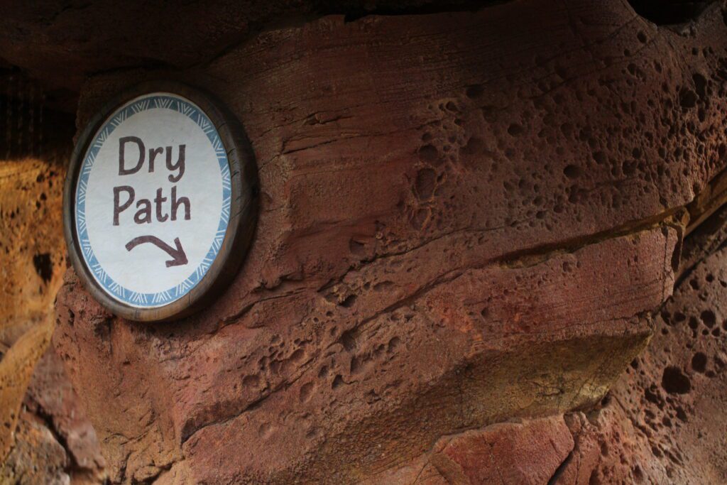 Dry path sign at the Moana water walk through at Epcot.