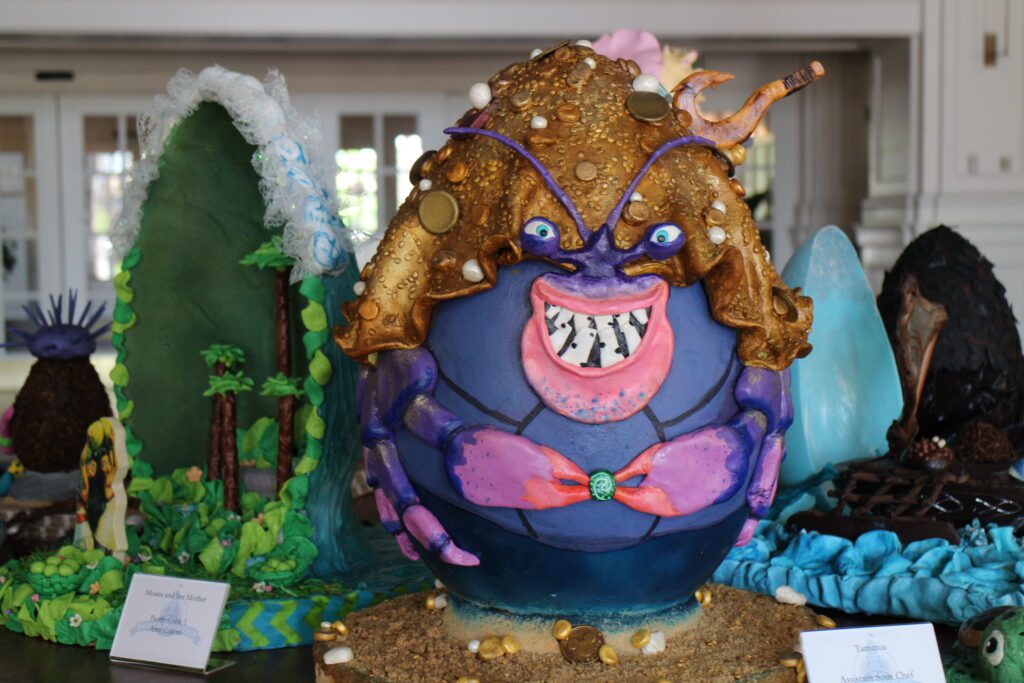 A chocolate easter egg on display at Disney World made to look like the crab from Moana who sings the Shiny song. He's purple with gold pieces on his back.