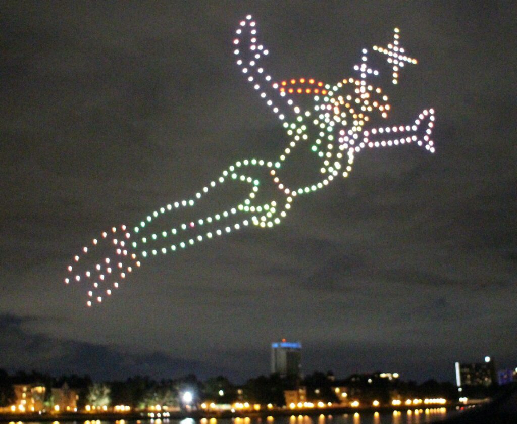 The shape of Peter Pan in drone in the night sky.