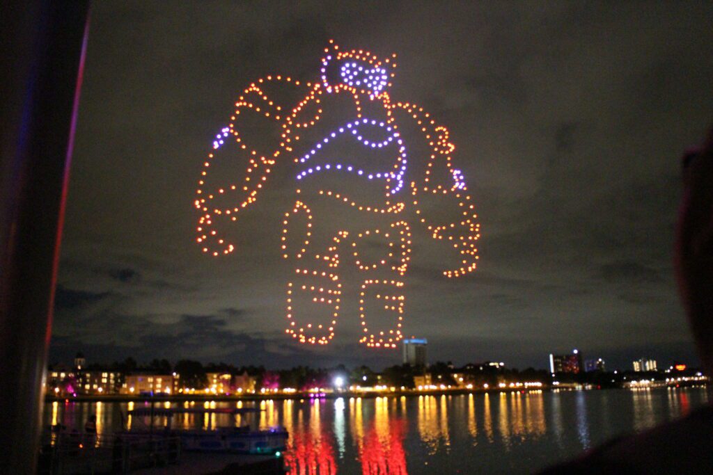 The shape of Baymax in drones in the night sky.