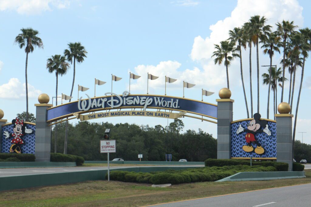 The Walt Disney World entrance gate, gray stone looking posts with Mickey and Minnie on either side.
