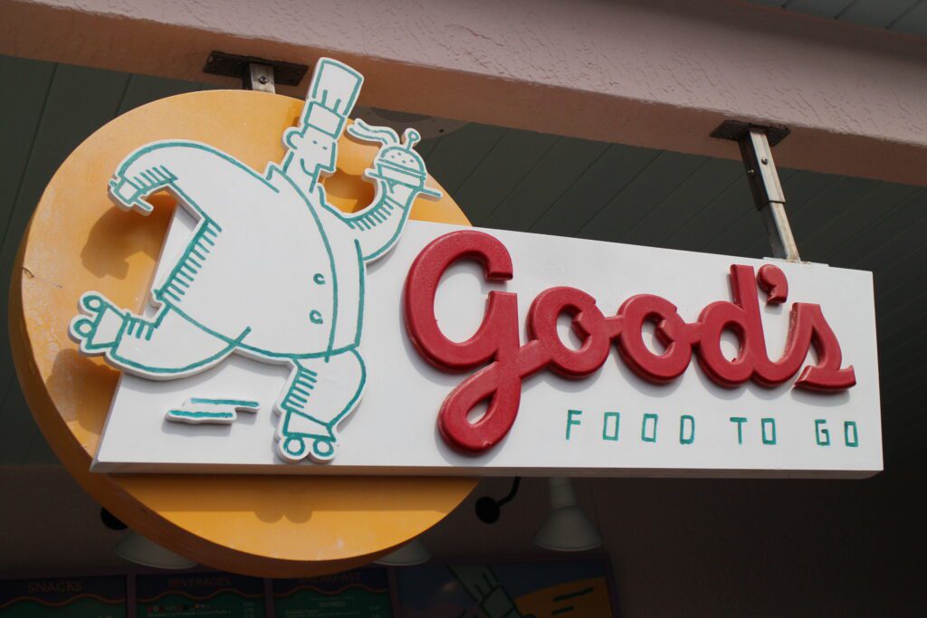 The Good's Food to Go logo with a rollerskating chef holding a burger in a sketch style.