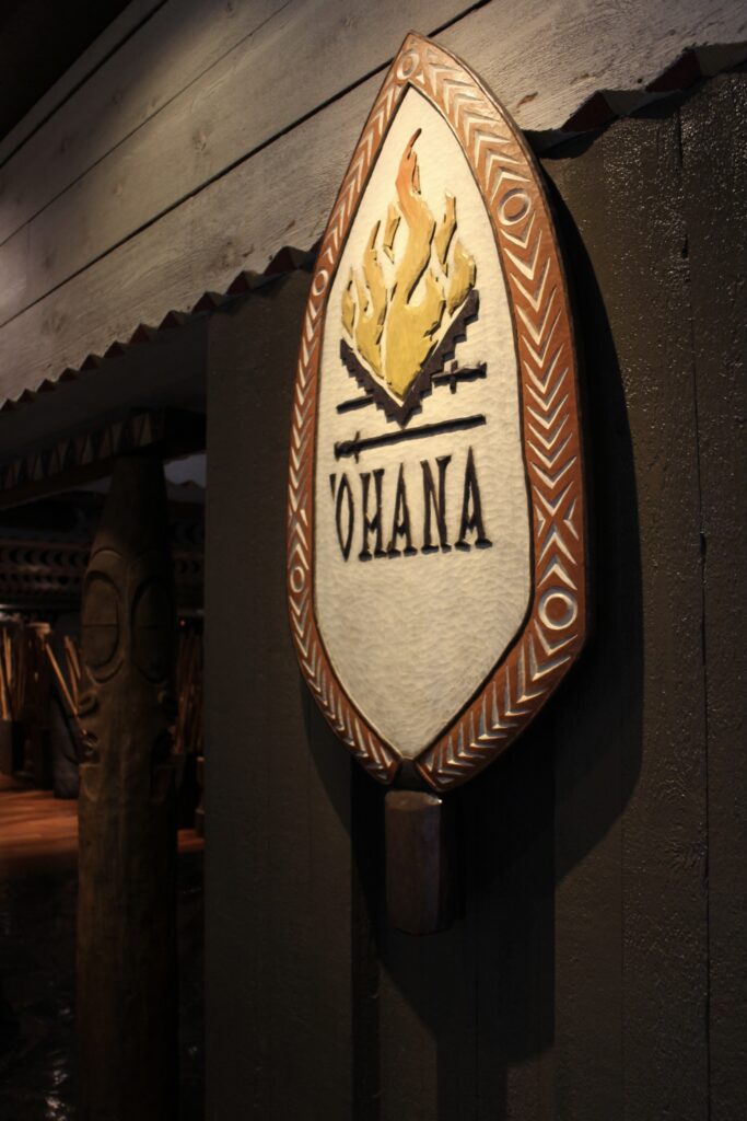 Ohana restaurant sign in a natural, carved aesthetic.