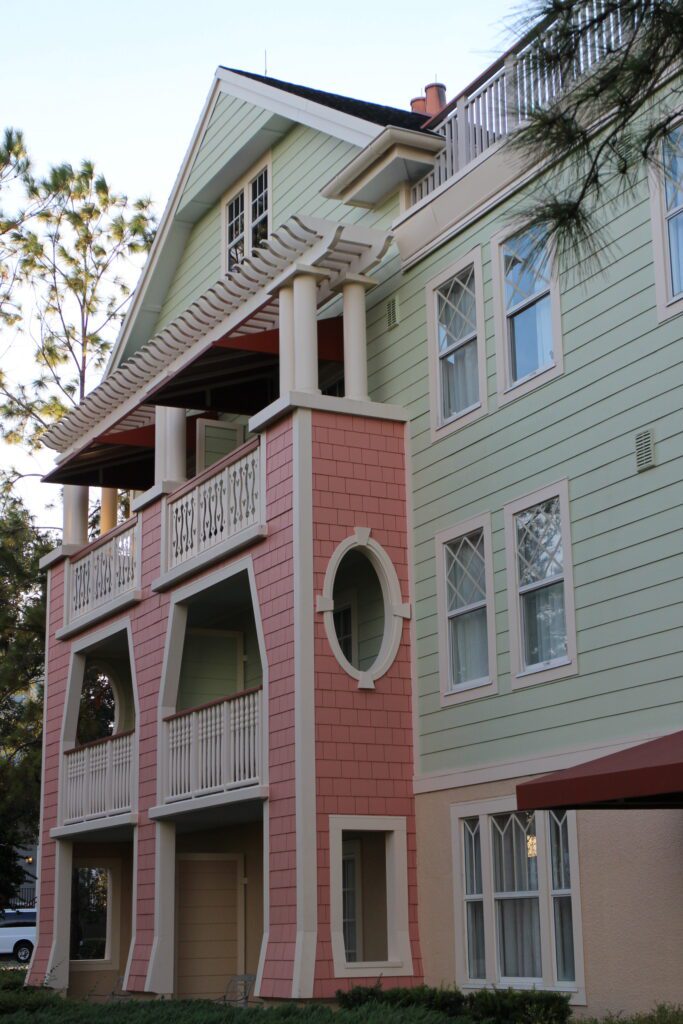 A three story building with pastel colors at Saratoga Springs Resort at Disney World.