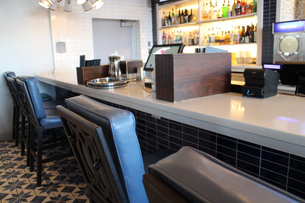 Chic barstools at an out of focus Bar Riva bar at Disney's Riviera Resort.