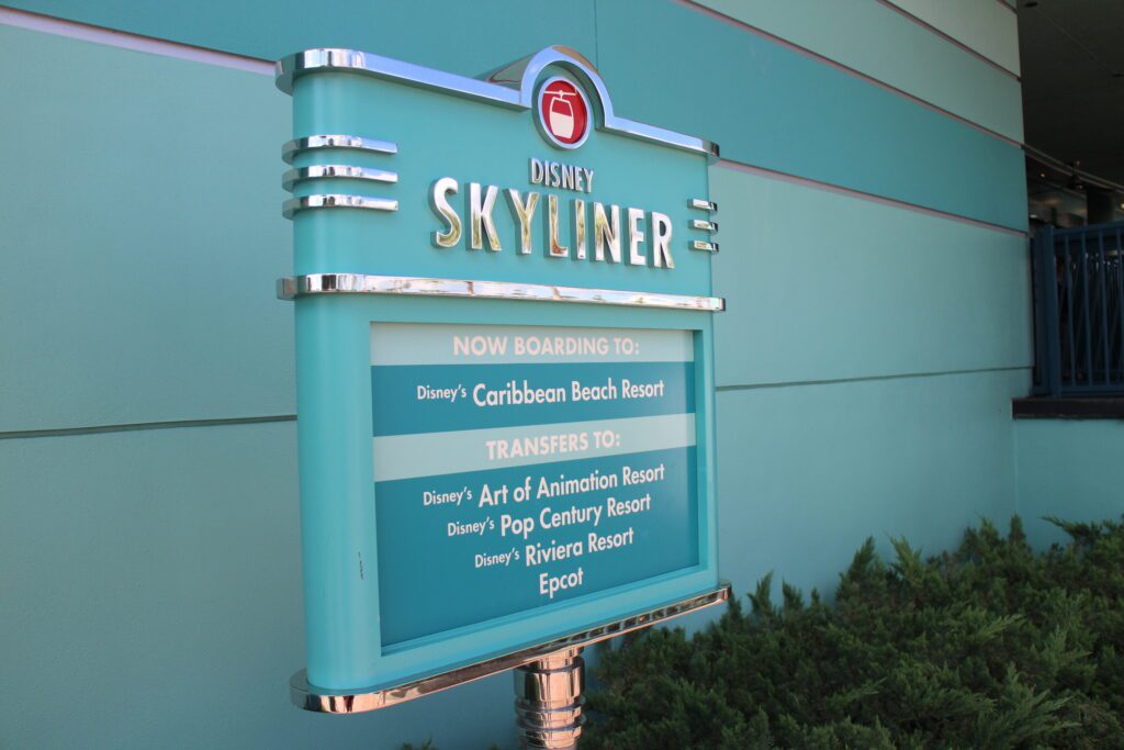 Disney Skyliner Resorts signs featuring hotels with stations.