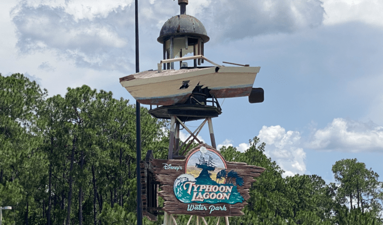 The Typhoon Lagoon sign with a small boat above it.