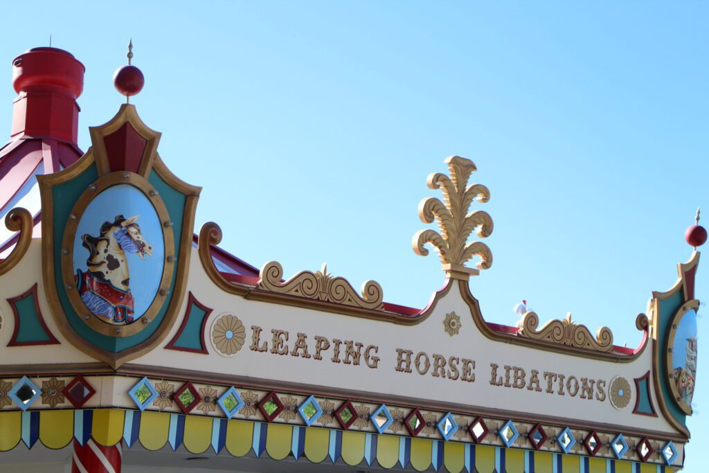 Leaping Horse Libations Disney World pool bar which looks like a carousel at Disney's BoardWalk.