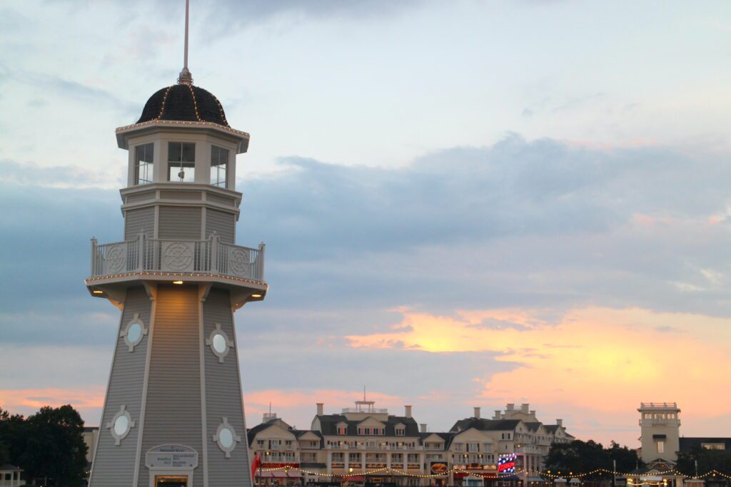 Yacht and Beach Club Lighthouse and the Disney BoardWalk during a pastel sunset. Both have Disney Skyliner bar crawl options.