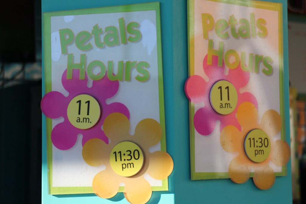 Petals Pool Bar hours sign shows 11 a.m. to 11:30 p.m. as the bar hours, while these may change regularly there is a chance it's usually open late, making it a great option for the Disney Skyliner pub crawl.