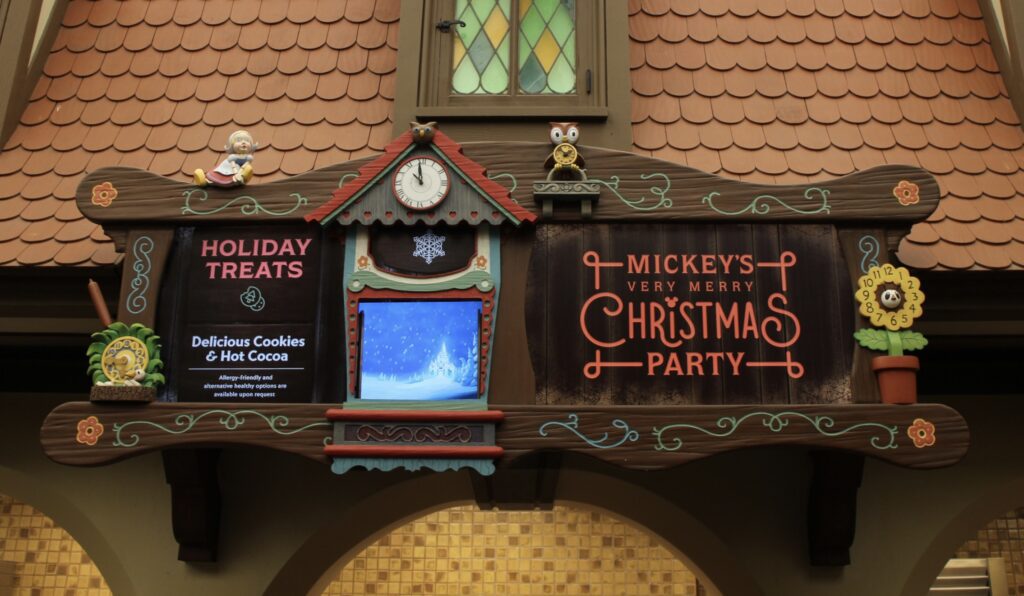 Disney World Christmas Party complimentary cookies and cocoa sign at Pinocchio's Village Haus restaurant.