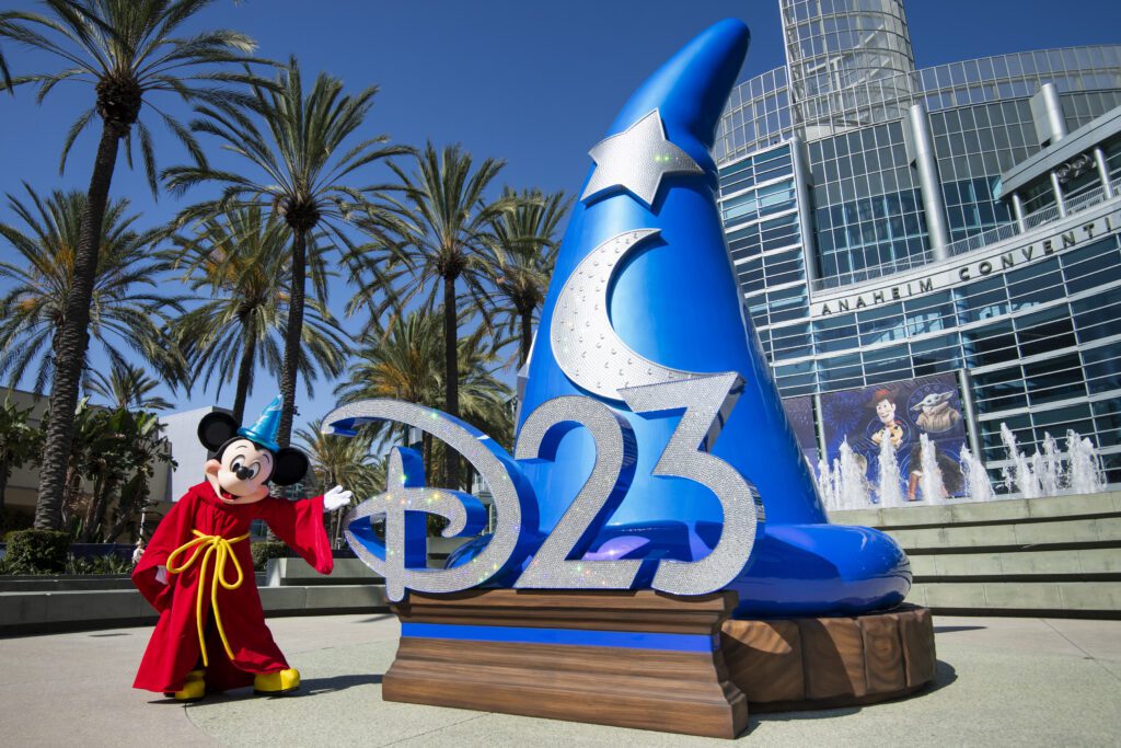 Sorcerer Mickey outside of the Anaheim Convention Center next to a large Sorcerer Mickey hat. This is where D23 Disney announcements are made.