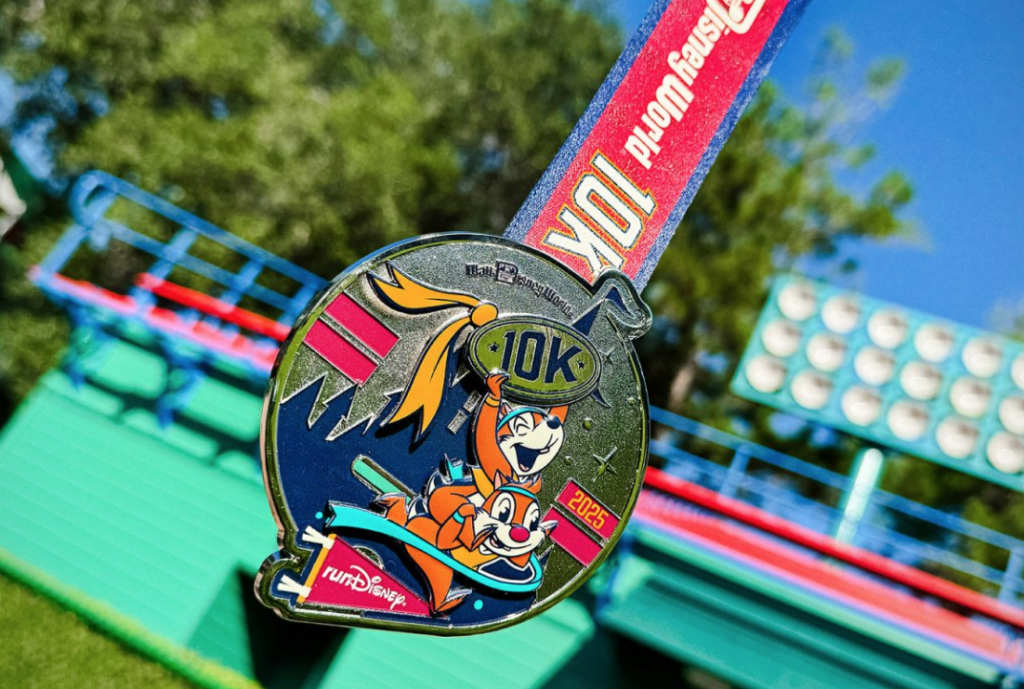 The Disney World 10K 2025 medal with Chip and Dale on it.