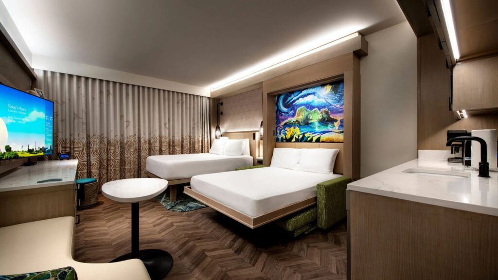 Polynesian Island Tower Deluxe Studio concept image with a Moana themed, pull down, queen size bed with Te Fiti art next to a regular queen size bed.