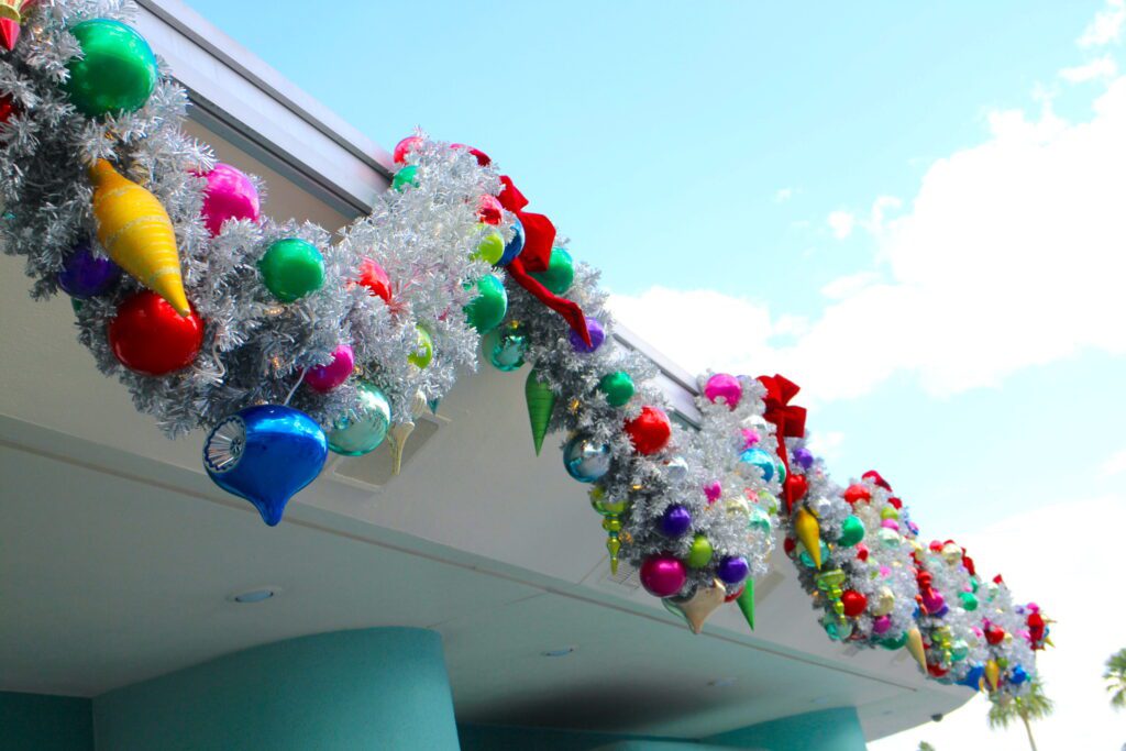 Jollywood Nights Hollywood Studios Christmas Vintage Decorations: silver garlands strung with colorful ornaments.