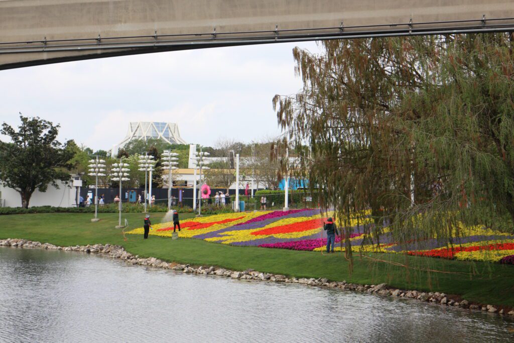 Disney horticulture Cast Members tend to the patchwork flowers at Epcot.