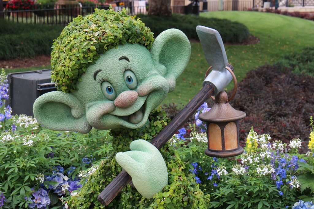 A topiary of the dwarf Dopey from Snow White.