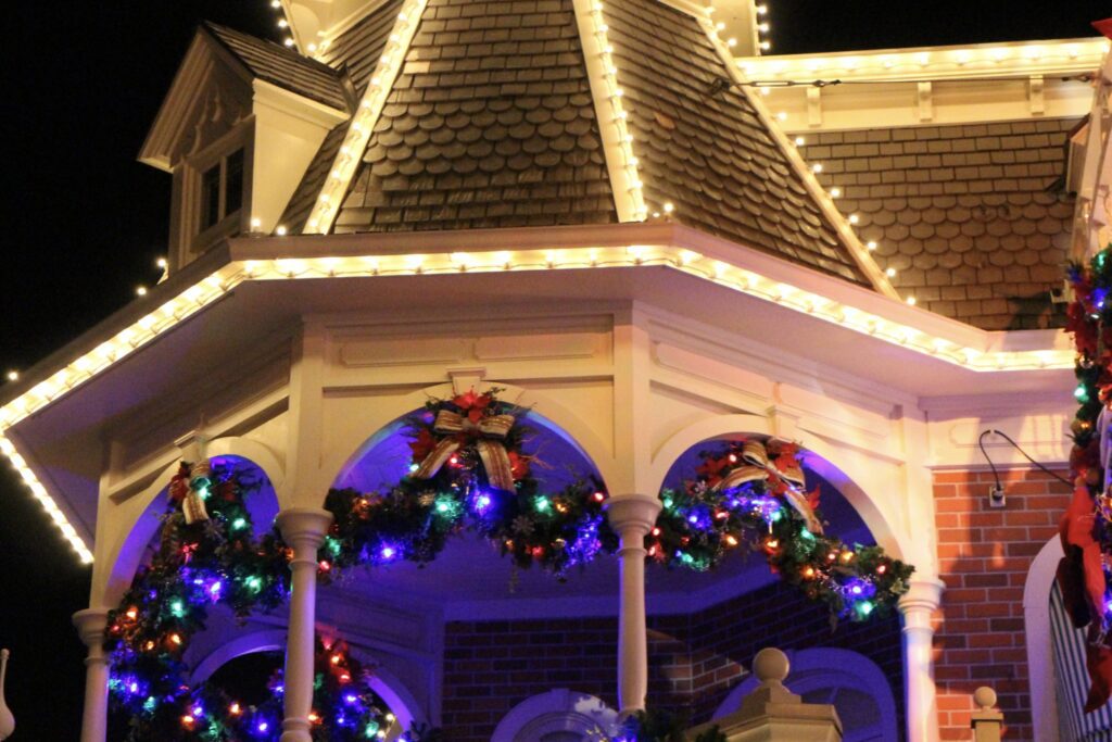 Garland hung on a turn of the century style building at Disney World.