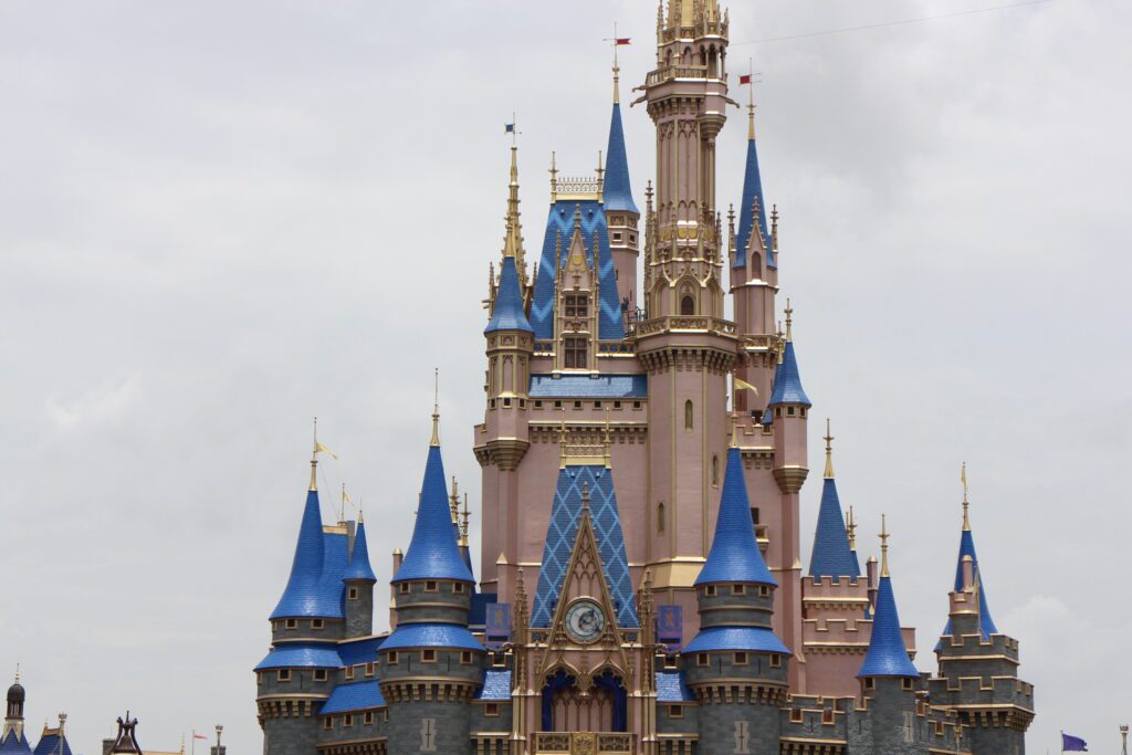 The Disney World castle with blue roof tops.