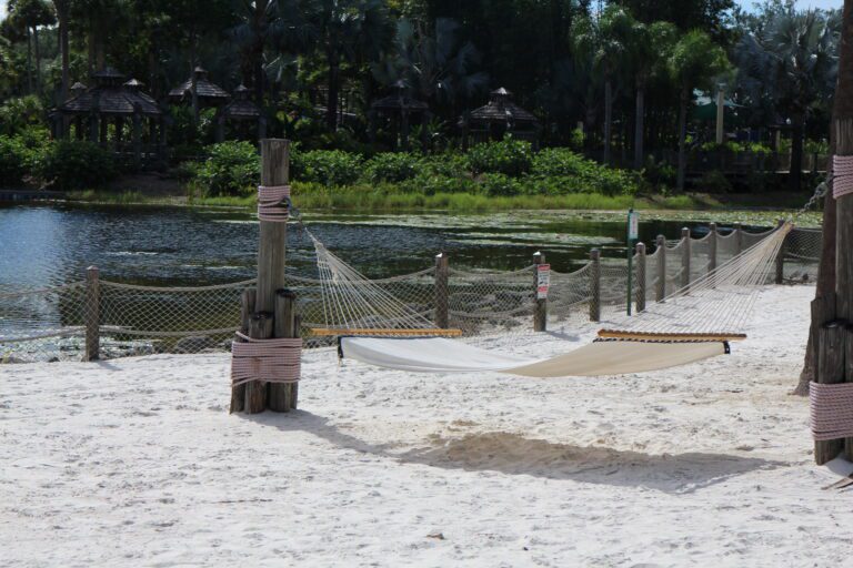 A hammock on the beach at the inexpensive Disney Caribbean Beach Resort.