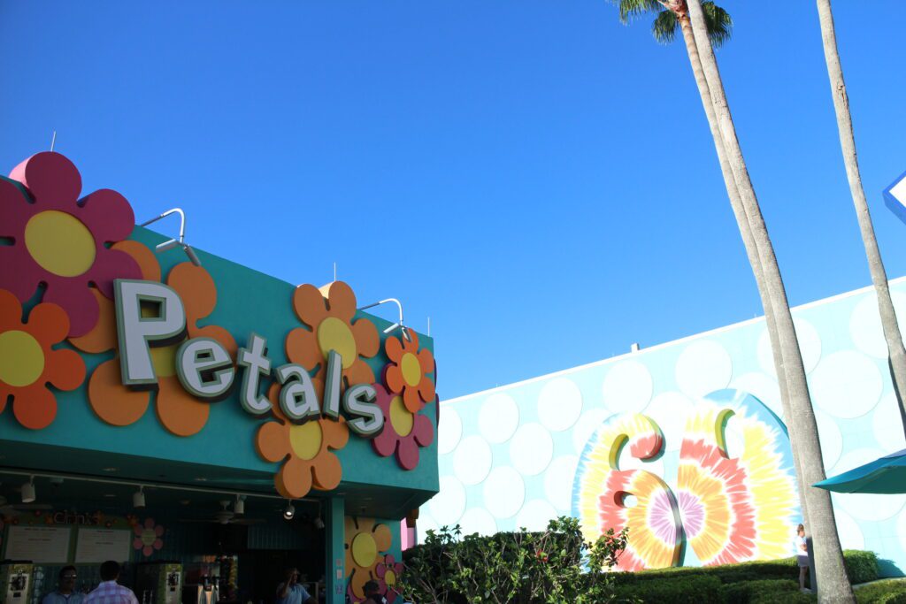 Petals Pool Bar colorful exterior with simple flower shapes and a walk up bar.